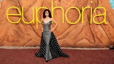 Alexa Demie dialled up the heat in an archival Bob Mackie piece, featuring a structured, strapless bodice and body-hugging skirt with striking metallic, chevron-like stripes. The ensemble was completed with a sweeping train featuring contrasting stripes, paired with diamond jewellery from Anita Ko, and rich black vintage curls. (Getty Images via AFP) Alexa Demie dialled up the heat in an archival Bob Mackie piece, featuring a structured, strapless bodice and body-hugging skirt with striking metallic, chevron-like stripes. The ensemble was completed with a sweeping train featuring contrasting stripes, paired with diamond jewellery from Anita Ko, and rich black vintage curls. (Getty Images via AFP)