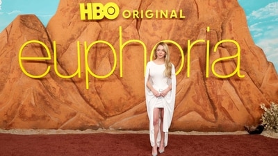 Sydney Sweeney arrived at the premiere in an archival 2007 white dress from Pierre Cardin. A floor-length cape was draped down her back and shoulders, while a rhinestone-encrusted bow cinched the waist. The outfit was paired with minimal sparkly diamond jewellery and crystal-embellished pointed-toe heels. (Getty Images via AFP) Sydney Sweeney arrived at the premiere in an archival 2007 white dress from Pierre Cardin. A floor-length cape was draped down her back and shoulders, while a rhinestone-encrusted bow cinched the waist. The outfit was paired with minimal sparkly diamond jewellery and crystal-embellished pointed-toe heels. (Getty Images via AFP)