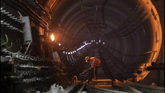 Pune, India - January 18, 2023: A man works in a tunnel near Civil Court underground metro station, in Pune, India, on Wednesday, January 18, 2023. (Photo by Pratham Gokhale/Hindustan Times) (Pratham Gokhale/HT Photo)