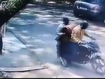 A CCTV video of the incident, accessed by HT, shows two men on a motorbike approach a house in Greater Noida, and after spending about two to three minutes inside, leave with two gas cylinders (Video Grab/HT)