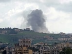 Smoke rises from the site of an Israeli strike on the outskirts of the southern Lebanese village of Choukine
