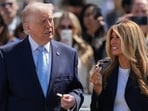 President Donald Trump and first lady Melania Trump talk during the White House Easter Egg Roll