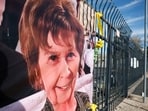 A photograph of Nancy Guthrie is displayed on a banner in front of the KVOA television station on March 01, 2026