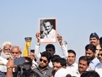 A supporter holds a portrait of former Maharashtra deputy chief minister Ajit Pawar during an event earlier this week.
