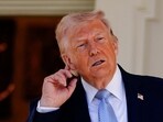 U.S. President Donald Trump gestures, as he heads back to the Oval Office, on the day of the 2026 White House Easter Egg Roll, in Washington, D.C., U.S., April 6, 2026. 
