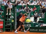 Russia's Daniil Medvedev smashes his racket on the clay during his match against Italy's Matteo Berrettini.
