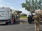 Sheriff's office personnel seen at the scene after David Morales shot a Tulare County deputy in Porterville, California.