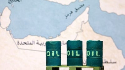 A map showing the Strait of Hormuz, also known as Madiq Hurmuz, and 3D printed oil barrels are seen in this illustration. (REUTERS)