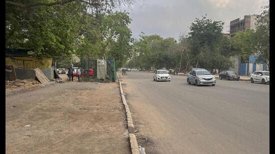 An incomplete pedestrian path portion of the Hamilton Court road near Sushant Lok-1 as seen on Wednesday. (Parveen Kumar)