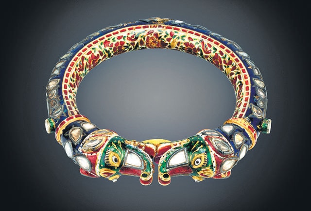 Maharani Jind Kaur’s enamelled gold bracelet set with white sapphires and foiled rubies, her pendent earrings, probably made in Lahore, in the first half of the 19th century ( Toor collection) Maharani Jind Kaur’s enamelled gold bracelet set with white sapphires and foiled rubies, her pendent earrings, probably made in Lahore, in the first half of the 19th century ( Toor collection)