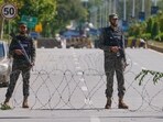 Soldiers stand guard at a checkpoint to ensure security ahead of the possible negotiations between the United States and Iran in the Pakistani capital, Islamabad, Pakistan, Friday, April 10, 2026.