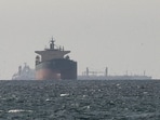 Cargo ships in the Gulf, near the Strait of Hormuz, as seen from northern Ras al-Khaimah. (Reuters)