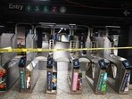 Police crime tape is placed at the subway turnstile after a reported stabbing and shooting at the Grand Central subway station in New York 