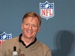 NFL Commissioner Roger Goodell smiles as he recognizes a reporter during a news conference at the NFL football annual meetings