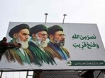 A man cleans a billboard featuring Iran's late supreme leaders Ayatollah Ruhollah Khomeini (L) and Ayatollah Ali Khamenei (C) next to newly elected supreme leader Ayatollah Mojtaba Khamenei, on the outskirts of Srinagar. (Photo for representation)