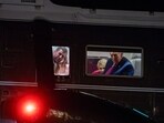US President Donald Trump and his entourage look out of the window of Marine One as it approaches the White House. Trump claimed on Truth Social on Saturday that the US was "clearing out" the Strait of Hormuz.