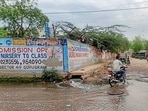A stretch of Badshahpur–Kadarpur Road flooded with sewage overflow, as seen earlier this month. (HT Photo)