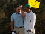 Golf - The Masters - Augusta National Golf Club, Augusta, Georgia, U.S. - April 12, 2026 Northern Ireland's Rory McIlroy celebrates with his caddie Harry Diamond on the green on the 18th hole after winning The Masters.