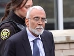 Subramanyam “Subu” Vedam walks outside the Centre County Courthouse in Bellefonte. (Geoff Rushton/StateCollege.com via AP)