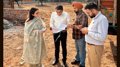 MC commissioner and other officials taking stock of the ongoing works in industrial area on Sunday. (HT File)