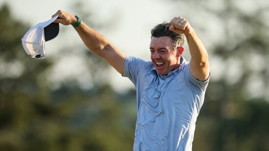 Rory McIlroy of Northern Ireland celebrates winning the 2026 Masters Tournament on the 18th green (Getty Images via AFP)