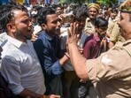 Employees of a company protest demanding a salary increment, in Noida on Monday.
