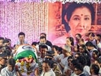 The Tricolour-draped mortal remains of Asha Bhosle during her state funeral in Mumbai on Monday, April 13.