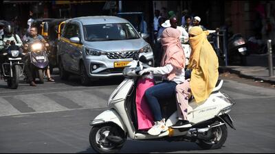 Pune, India -March 19, 2024:People wear scarf, gloves, goggles,during summer seasos at Laxmi road in Pune, India,Tuesday, -March 19, 2024-HT photo Pune, India -March 19, 2024:People wear scarf, gloves, goggles,during summer seasos at Laxmi road in Pune, India,Tuesday, -March 19, 2024-HT photo