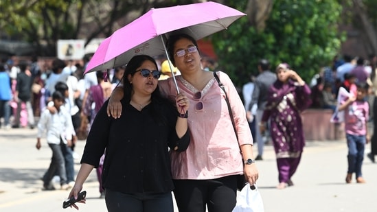 Gram it: Delhiites, brace yourself to witness hot weather this week as the temperature is likely to reach 40°C by April 15. Here's how young visitors at the Red Fort are taking shade the umbrellas while fulfilling their wander lust on a sunny afternoon in Delhi.(Photo: Vipin Kumar/ Hindustan Times)