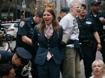Chelsea Manning, center, is arrested by police as protesters with Jewish Voice for Peace block traffic during a demonstration outside the New York office of U.S. Sen. Chuck Schumer, calling for an end to the U.S.-Israel war with Iran and opposing U.S. weapons support on Monday, April 13, 2026, in New York. (AP Photo/Andres Kudacki)