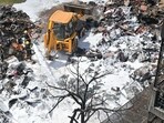 Around 200 families’ belongings stored in makeshift tents caught fire; residents flag recurring encroachments and C&D waste dumping on the plot. (Parveen Kumar/HT)