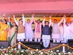 Chief minister Nayab Singh Saini and Union minister Arjun Ram Meghwal, along with other leaders, during an event in Panchkula on Tuesday. (HT)