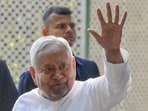 Bihar chief minister Nitish Kumar greets upon arrival at his residence K Kamraj Lane in New Delhi.