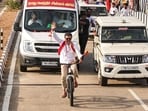Tamilaga Vettri Kazhagam (TVK) chief and actor Vijay rides a bicycle during a roadshow ahead of the Tamil Nadu Assembly elections, in Kanniyakumari.