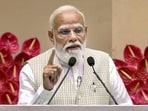 Prime Minister Narendra Modi gives an address during the 'Nari Shakti Vandan Sammelan', at Vigyan Bhawan, in New Delhi. 