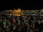 People gather to offer prayers at Golden Temple on the eve of Baisakhi, in Amritsar, Punjab