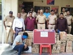 The seized liquor is valued at about <span class='webrupee'>₹</span>2 lakh, while the car and other assets recovered are worth around <span class='webrupee'>₹</span>23 lakh. (HT)