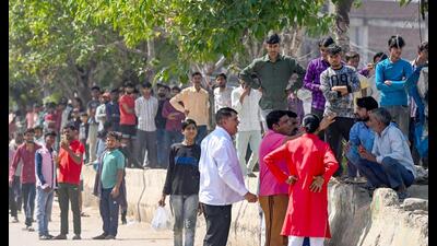 Workers seen during the protest in Noida Phase 2 Industrial Area on Tuesday. (Sunil Ghosh/HT) Workers seen during the protest in Noida Phase 2 Industrial Area on Tuesday. (Sunil Ghosh/HT)