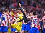 Atletico Madrid's players celebrate at the end of the Champions League quarterfinal second leg soccer match between Atletico Madrid and Barcelona