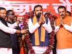 Bihar chief minister Samrat Choudhary, centre, being garlanded by state BJP president Sanjay Saraogi, right, and others during a felicitation ceremony at the party office in Patna on Wednesday. (PTI)