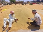 Farmers inspect the wheat grain at the New Grain Market in Patiala. (ANI)