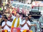 Prime Minister Narendra Modi, Leader of Opposition in the Tamil Nadu assembly and AIADMK chief Edappadi K Palaniswami, Tamil Nadu BJP president Nainar Nagenthran and others during a roadshow in Nagercoil, Kanyakumari district. (@NarendraModi/via PTI)