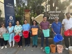 The protests began around 4 pm across multiple societies, including Nyati Ethos and Nyati Evara, where residents, many of them senior citizens, gathered and raised slogans against the lack of water supply. (HT PHOTO)