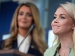 White House press secretary Karoline Leavitt smiles as Small Business Administration Chief Kelly Loeffler looks on during a news conference in the James Brady Press Briefing Room at the White House, Wednesday, April 15, 2026, in Washington.