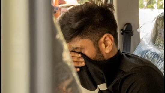 Mumbai Police escort an accused to a Borivali court after arresting five individuals in connection with the deaths of two students who allegedly consumed drugs during a live concert at the NESCO Centre in Mumbai, (Hindustan Times/Satish Bate)