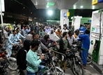 Clients queue at a gas station amid rising petrol prices in Karachi 