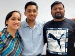Divyansh Jaju of Police DAV School with his parents in Ludhiana on Wednesday. (HT Photo)
