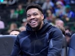 Giannis Antetokounmpo #34 of the Milwaukee Bucks looks on from the bench during the second half of the game against the Memphis Grizzlies 
