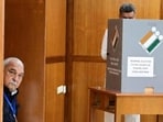 Haryana Congress Legislature Party (CLP) leader and former chief minister Bhupinder Singh Hooda looking on as Panchkula MLA and ex-deputy CM Chander Mohan casts his vote for the Rajya Sabha election in Chandigarh on March 16. (HT file photo)