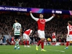 Arsenal's William Saliba celebrates after the match